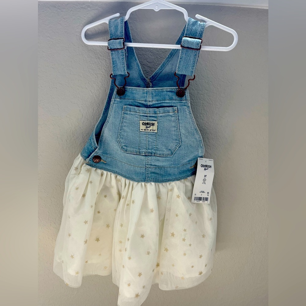 Super cute Oshkosh over all dress with sparkle stars on the bottom